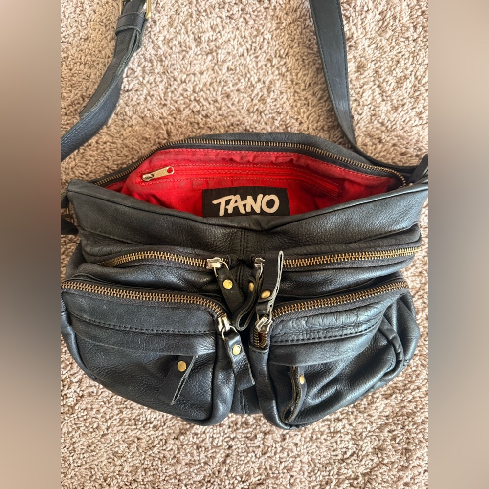 Tano Black Leather Messenger Bag with Vibrant Red Lining
